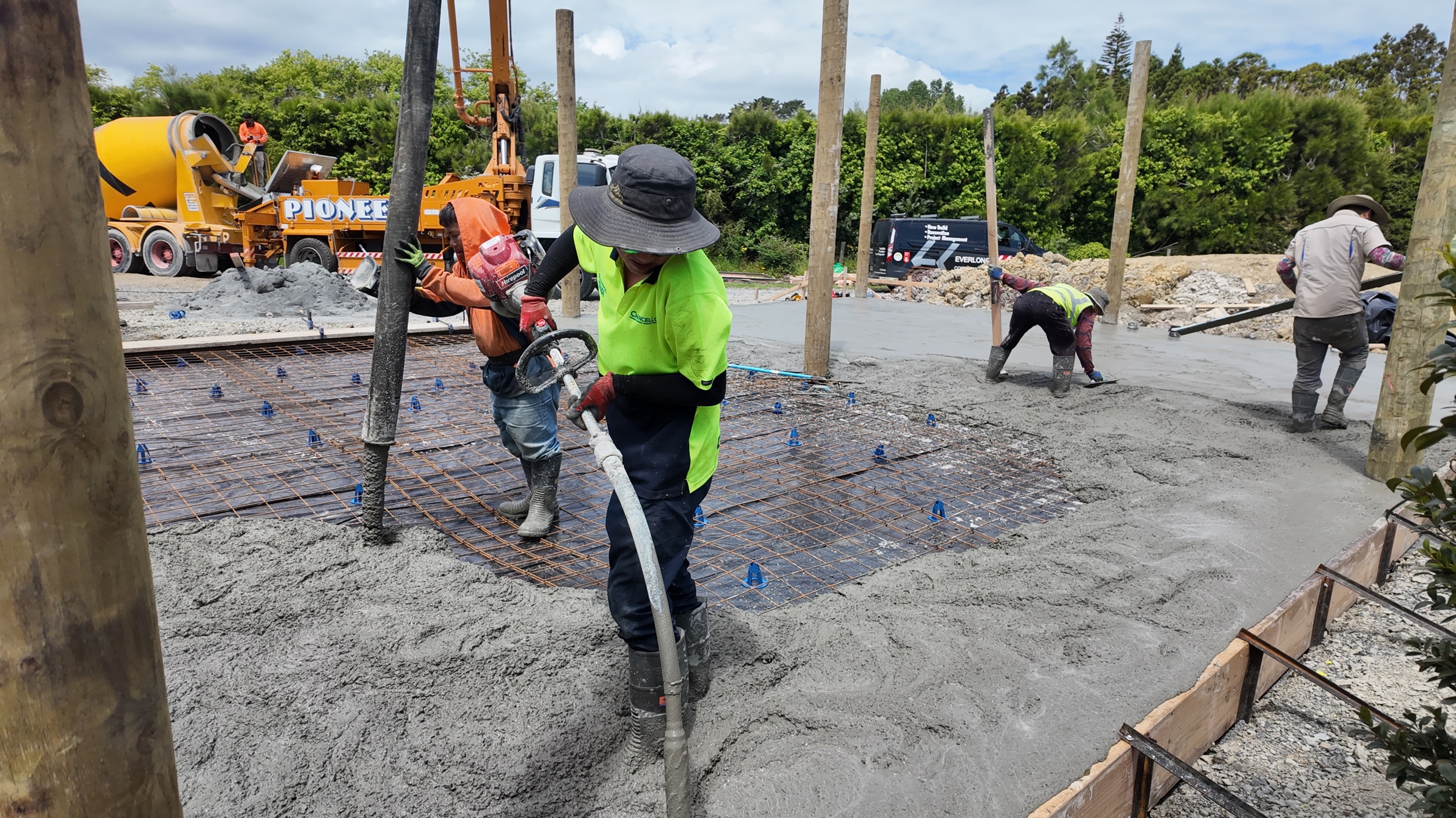 Everlong team placing concrete for the new garage slab