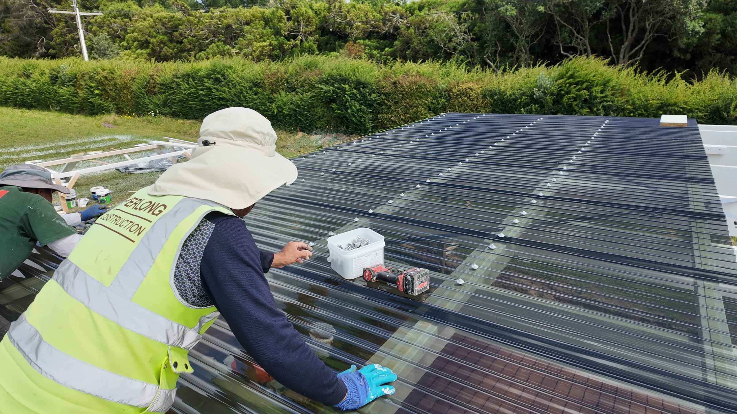 Everlong team installing translucent veranda roofing