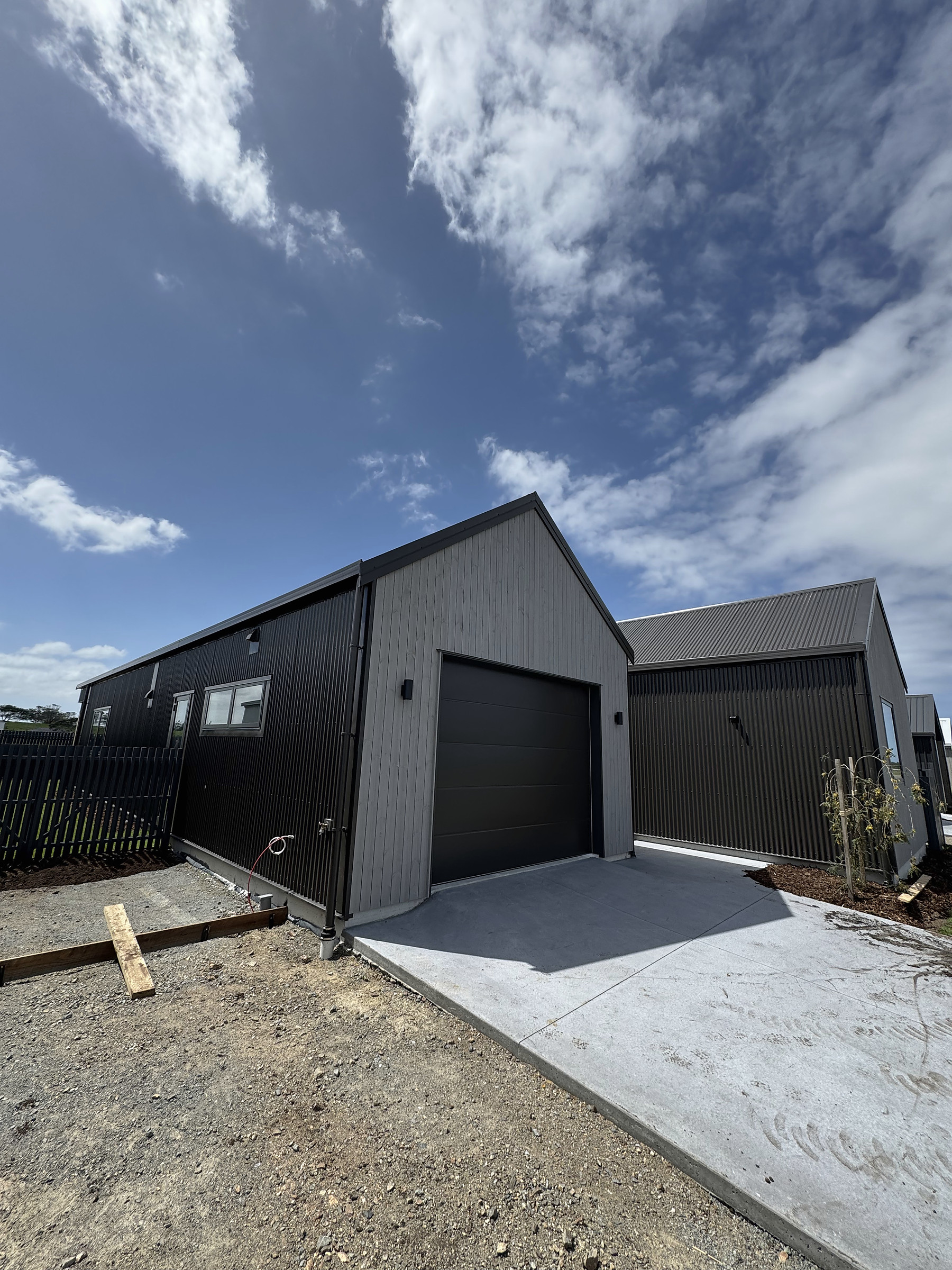 Garage and dark cladding of House 44