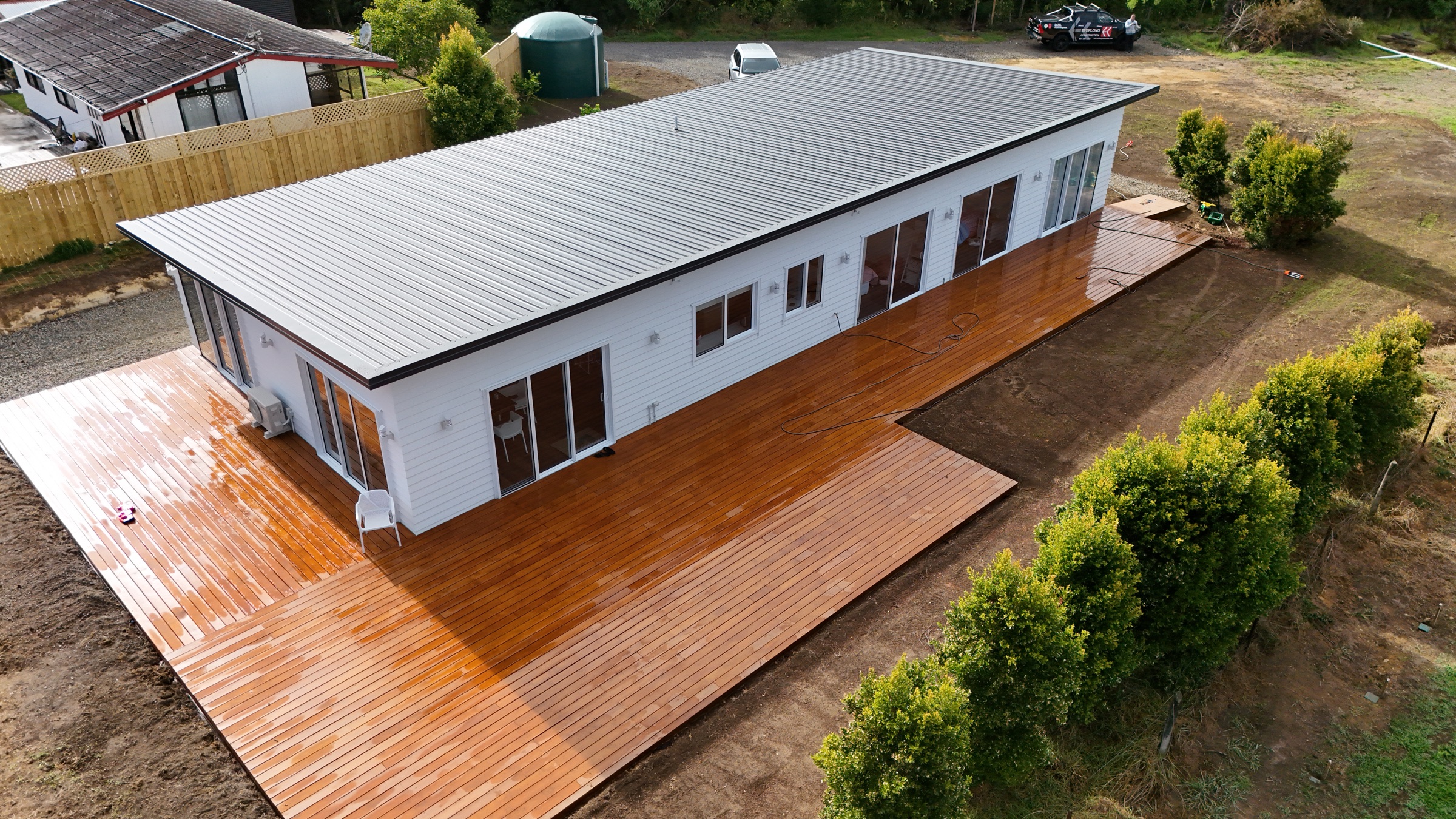 Aerial view of the completed home and wraparound deck