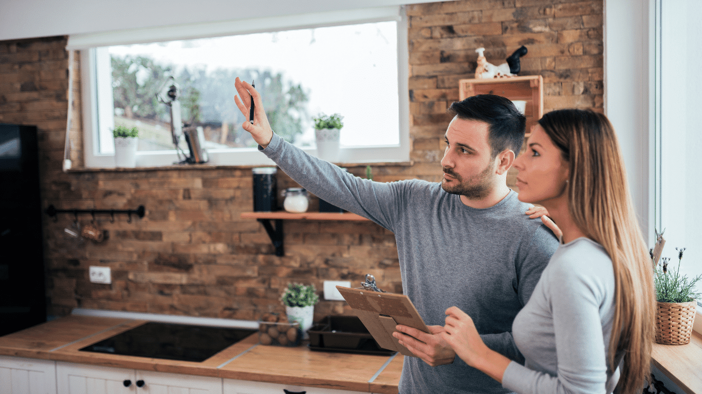 Couple planning for home extension inside the house.